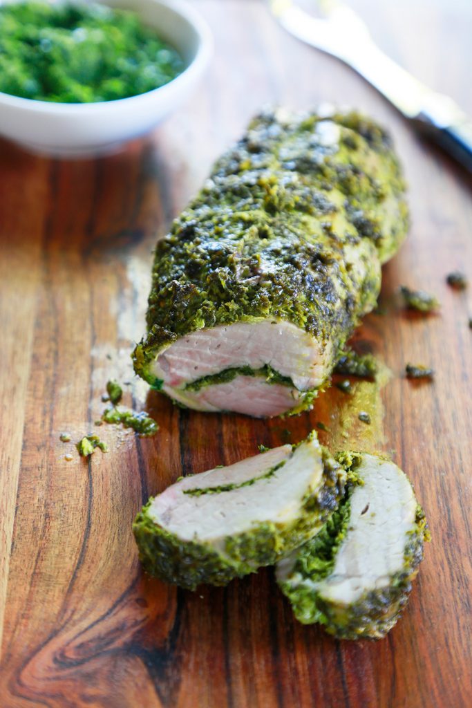 Sliced herb crusted pork tenderloin.